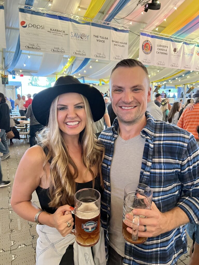 Justin and his wife, Megan, at Tulsa Oktoberfest, an annual festival boasting over 200 German and local beers.