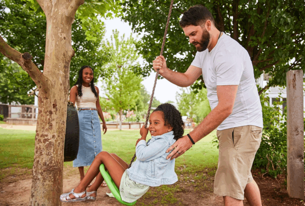 A young family plays in Carlton Landing, Oklahoma, the newest established city in the state.