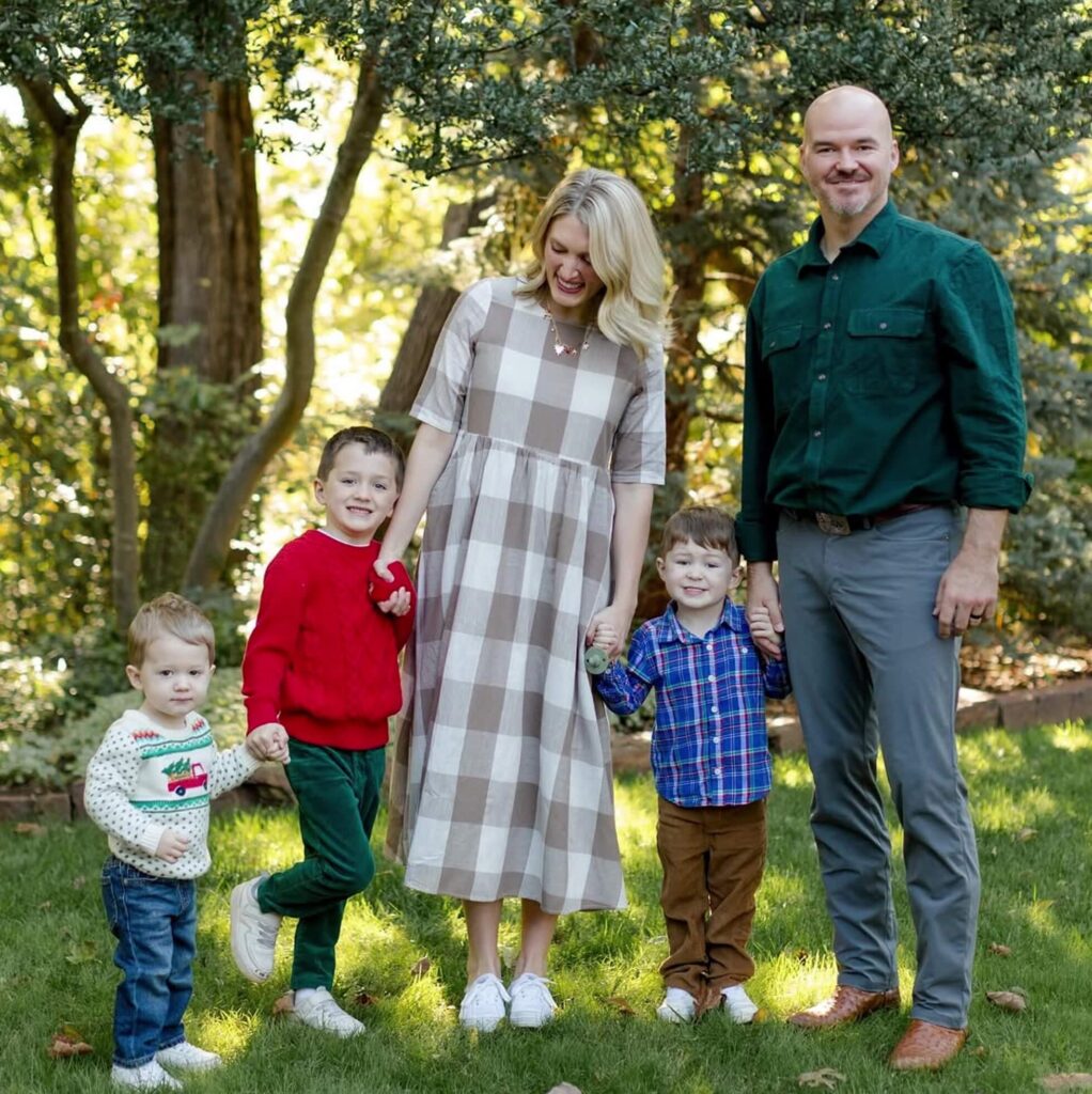Alli Cooper, her husband, and three young children pose for a family portrait after moving back to Oklahoma