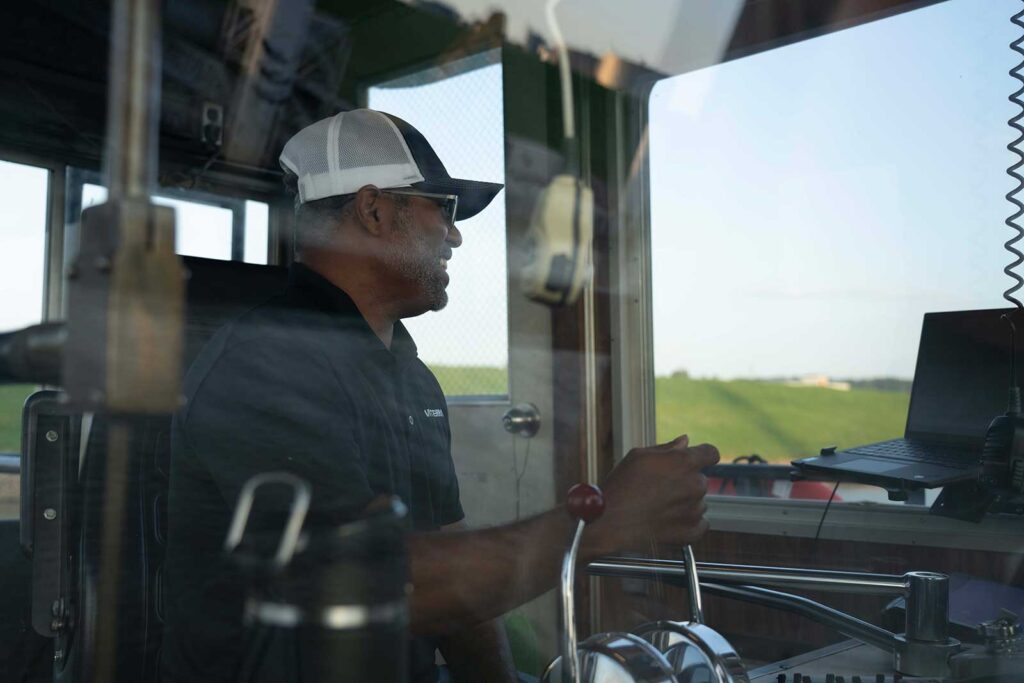 A man steers a vehicle