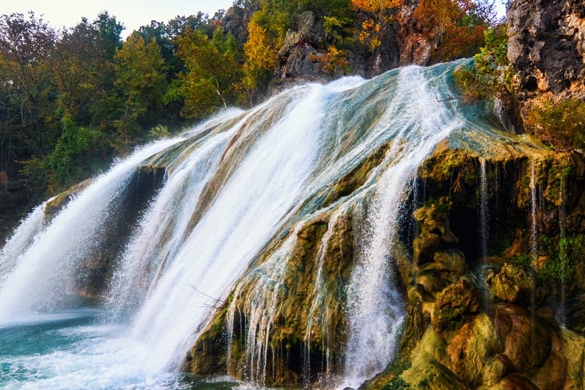 Waterfall in the fall with leaves changing