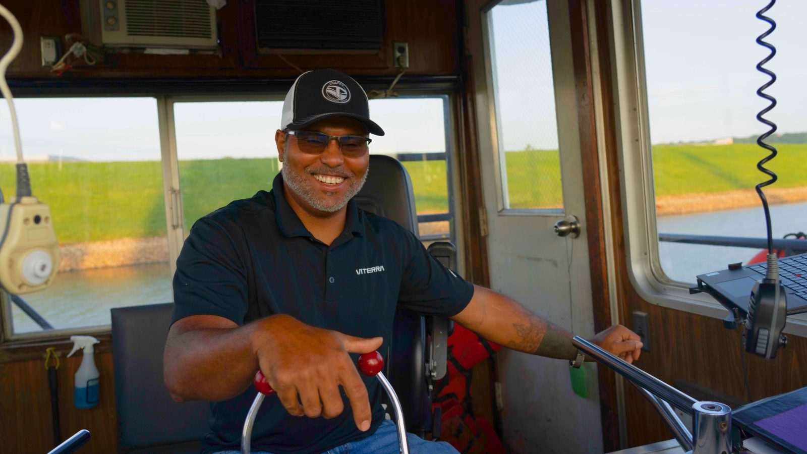 A happily employed man operating a boat on a river in Oklahoma. Oklahoma is one of the easiest states to find a job.